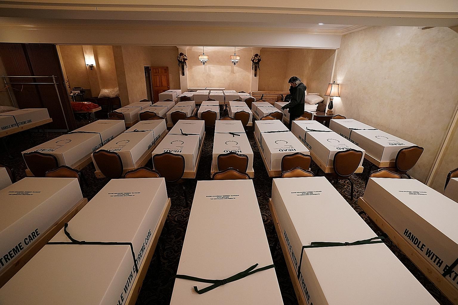 Caskets in a funeral home in Queens, New York, on Sunday. Total fatalities in New York City are now 17,280, even as new hospitalisations and intensive care cases continue to fall. PHOTO: REUTERS