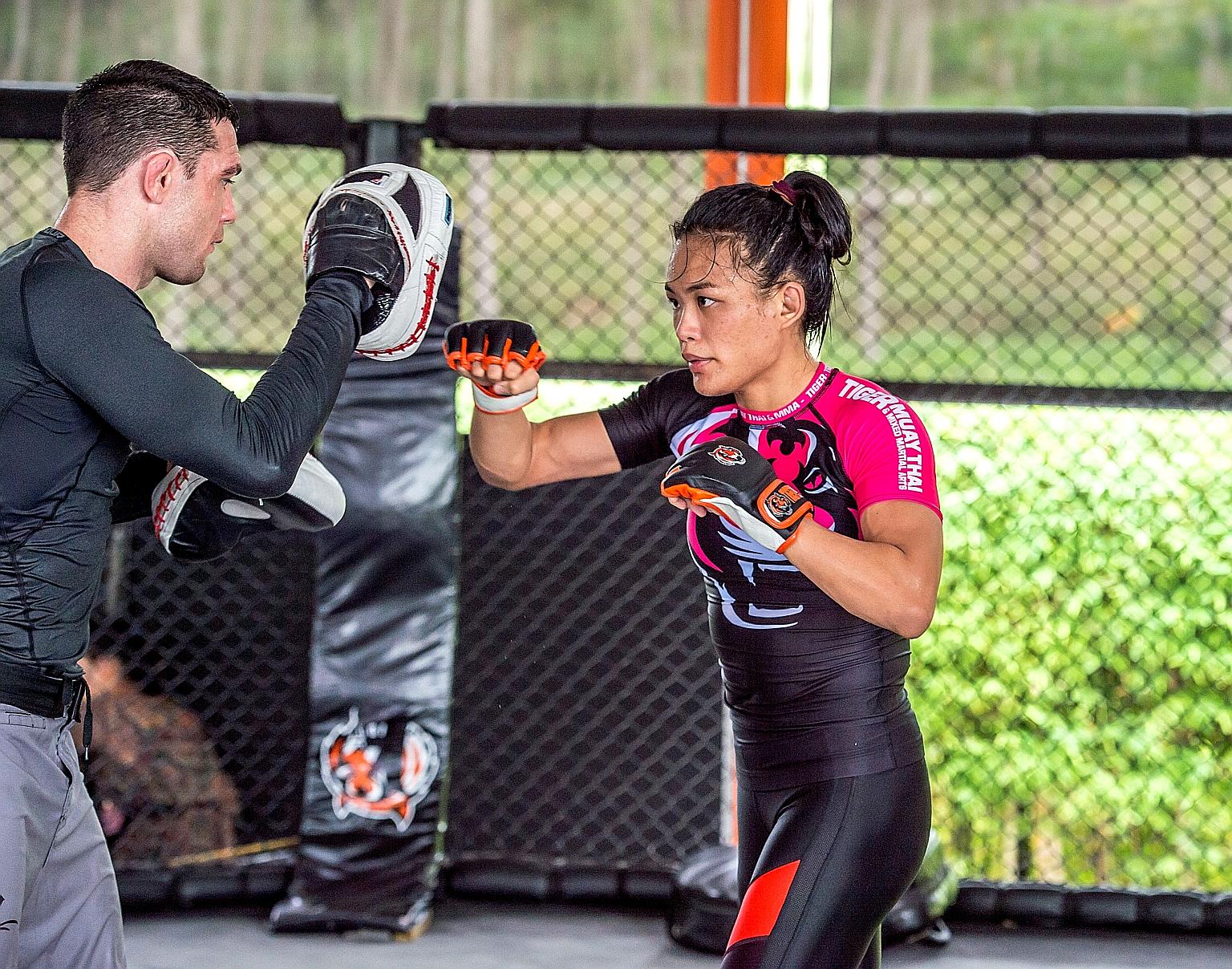 Singapore MMA fighter Tiffany Teo, who is the top-ranked contender for the strawweight title held by China's Xiong Jingnan, has given the thumbs up to the rankings list. PHOTO: ONE CHAMPIONSHIP