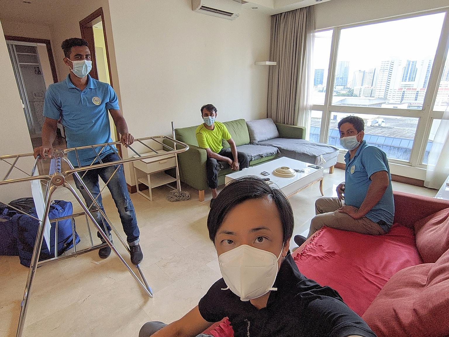 Mr Clarence Chua (foreground) managed to move three of his employees - (from left) Mr Ibrahim Darzi, Mr Md Jowel Rana and Mr Roy Kumar - out of Sungei Tengah Lodge to an apartment in Bugis.