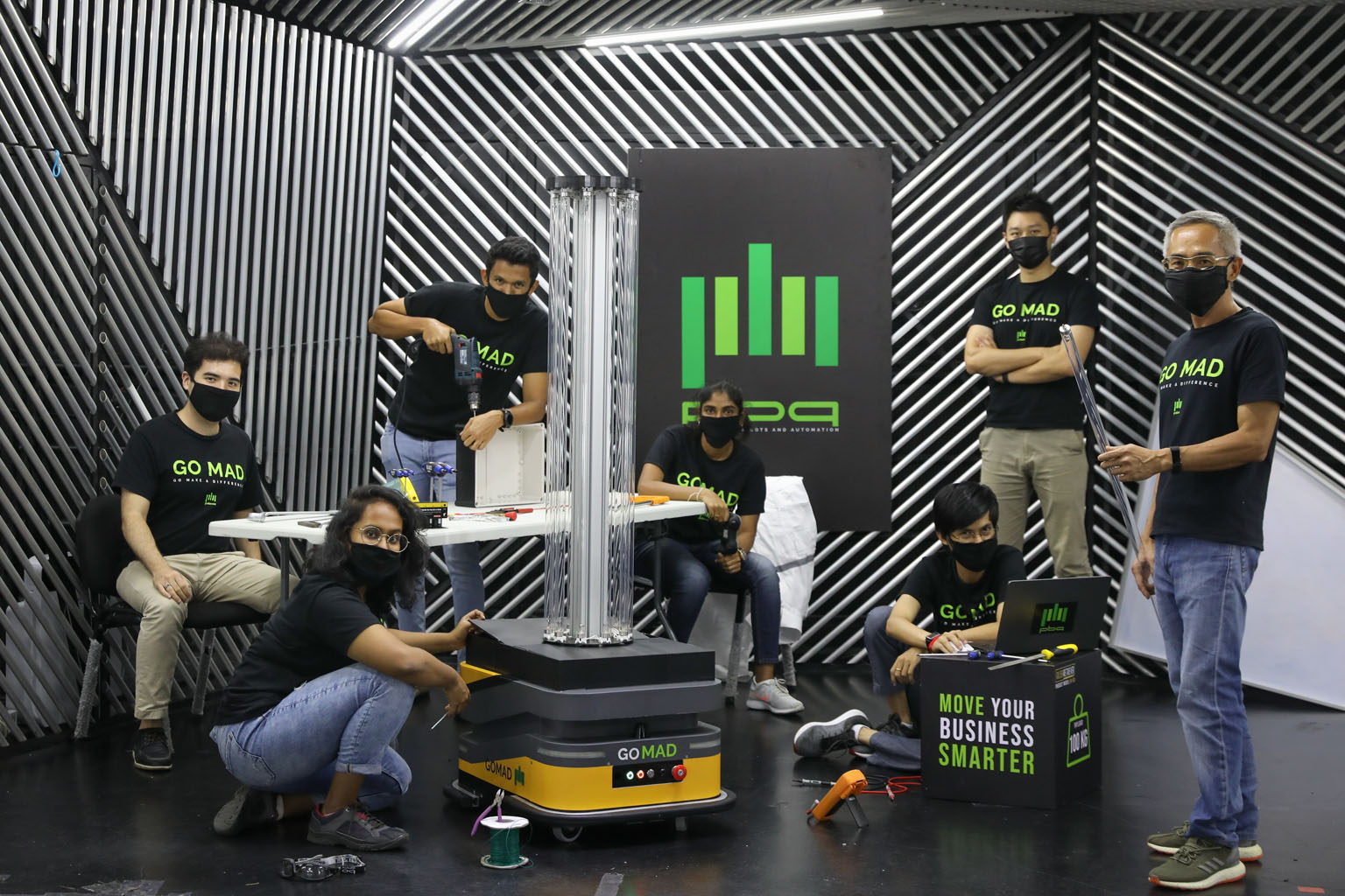 PBA Group's Sunburst UV Bot engineering team members (from left) Gavin Davies, Suhasini Padmanathan, Jeremy Joseph Danker, Meera Vijayakumar, Htet Arkar Swe, Chen Jia Hao and Joseph Yap. The robot can move around autonomously and disinfect surfaces u