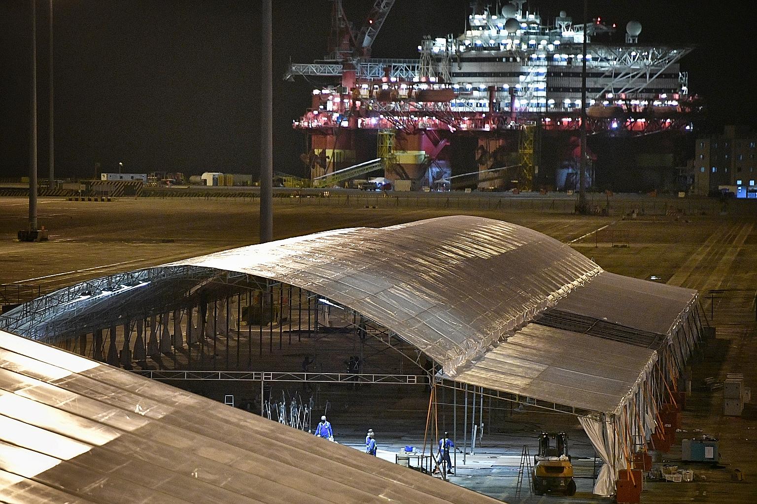 Marquees being set up at a Tanjong Pagar Terminal site yesterday. By the end of June, Singapore aims to have some 41,000 beds for isolation and care, including at community care and recovery facilities. ST PHOTO: ARIFFIN JAMAR