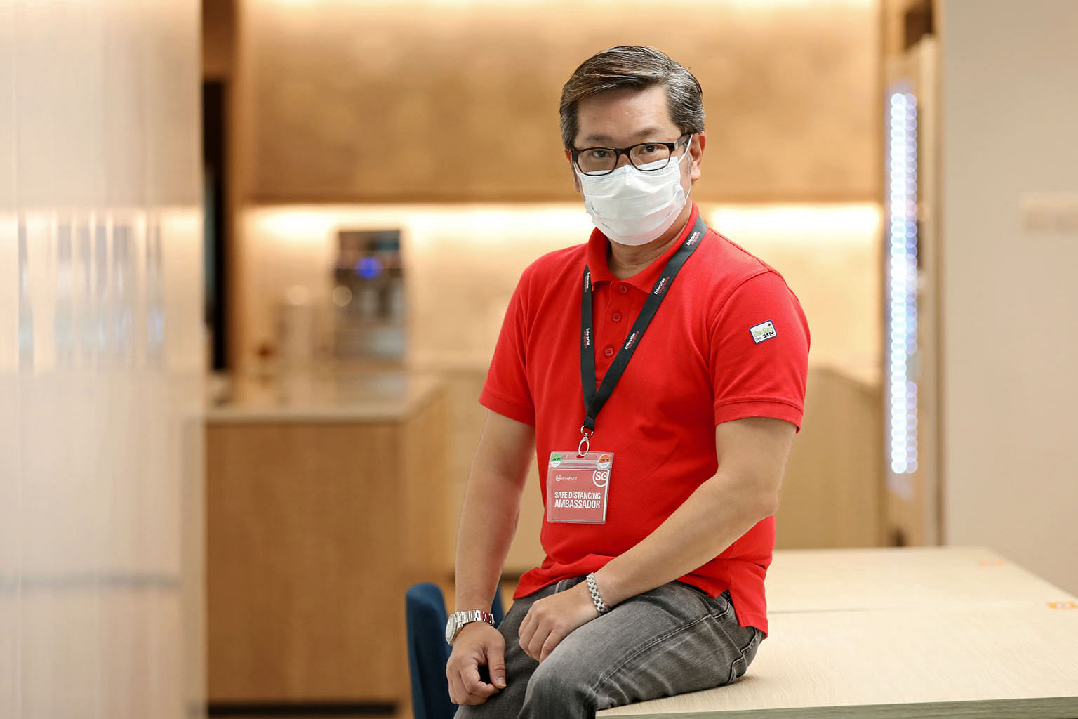 Mr Richard Lim, who works as a tour manager, signed up to be a safe distancing ambassador with Enterprise Singapore earlier this month, after the travel industry came to a halt. He now patrols Jurong Point mall five to six days a week.