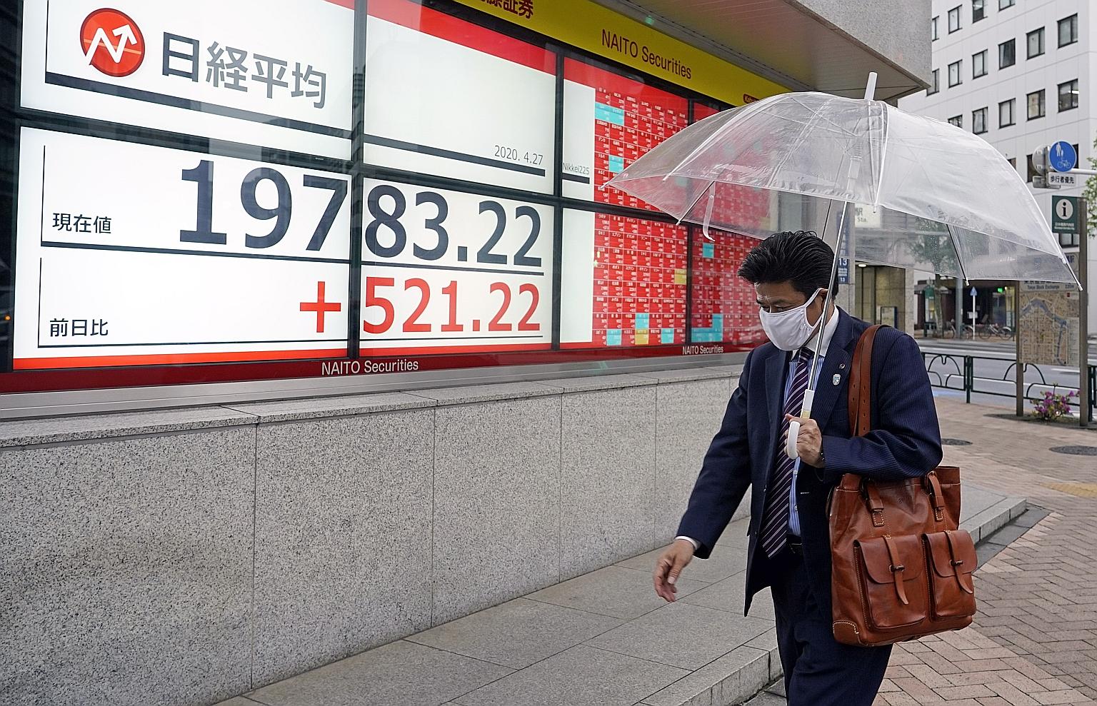 A stock market indicator board in Tokyo on Monday showing a rise in prices after new stimulus measures from the Bank of Japan. The MSCI Asia Pacific Index, the Asian benchmark, is up 20 per cent from its four-year low last month, and analysts are bul