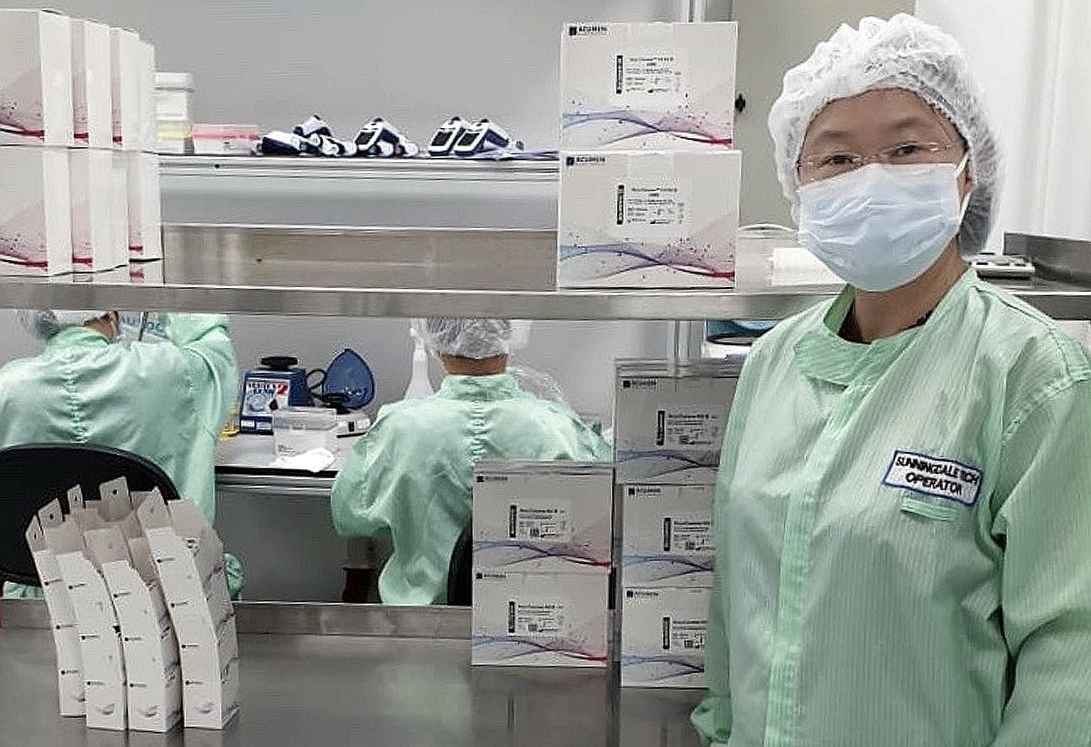 Dr Ong Siew Hua (right), director and chief scientist of home-grown biotech company Acumen Research Laboratories, says local biotech firms are able to scale up the number of Covid-19 tests done in Singapore daily, should mass testing become necessary
