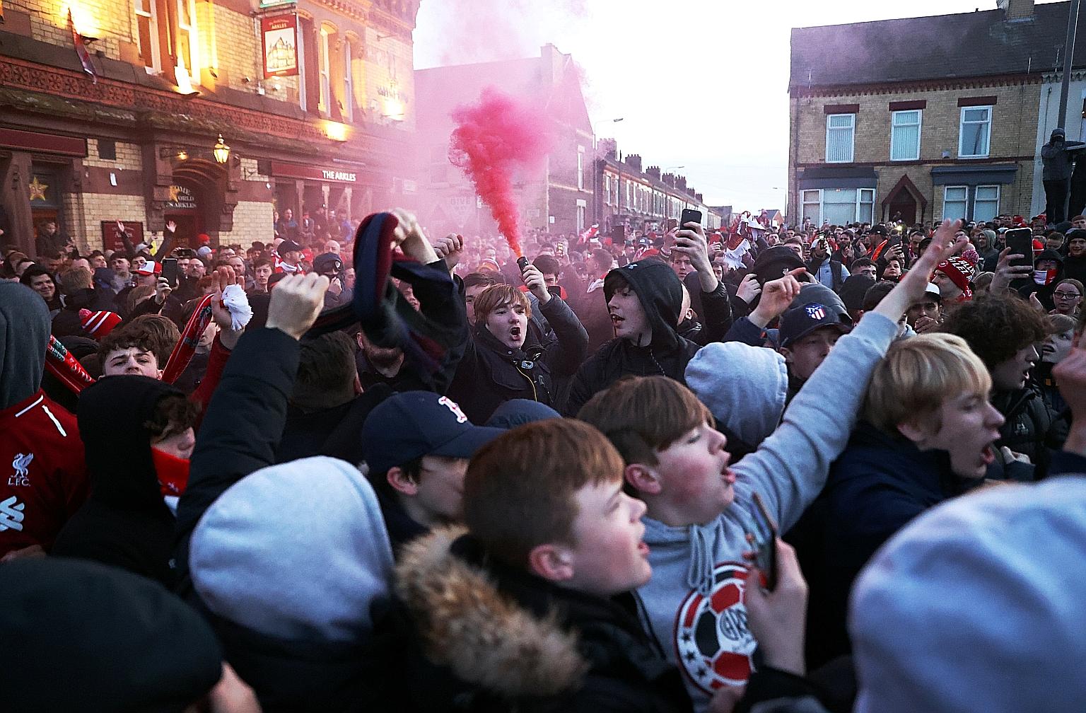 Fans outside Anfield during Liverpool's Champions League last-16, second-leg clash against Atletico Madrid in March. PHOTO: REUTERS