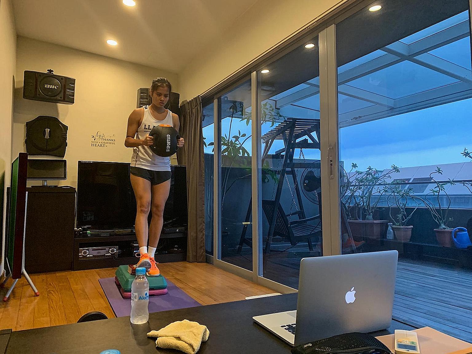 Rachel Ling taking part in one of the national netball team's gym sessions over Zoom. Opens team newcomer Pooja Senthil Kumar has been using a mini basketball hoop and a scrunched-up piece of paper to practise her shooting in her living room during t