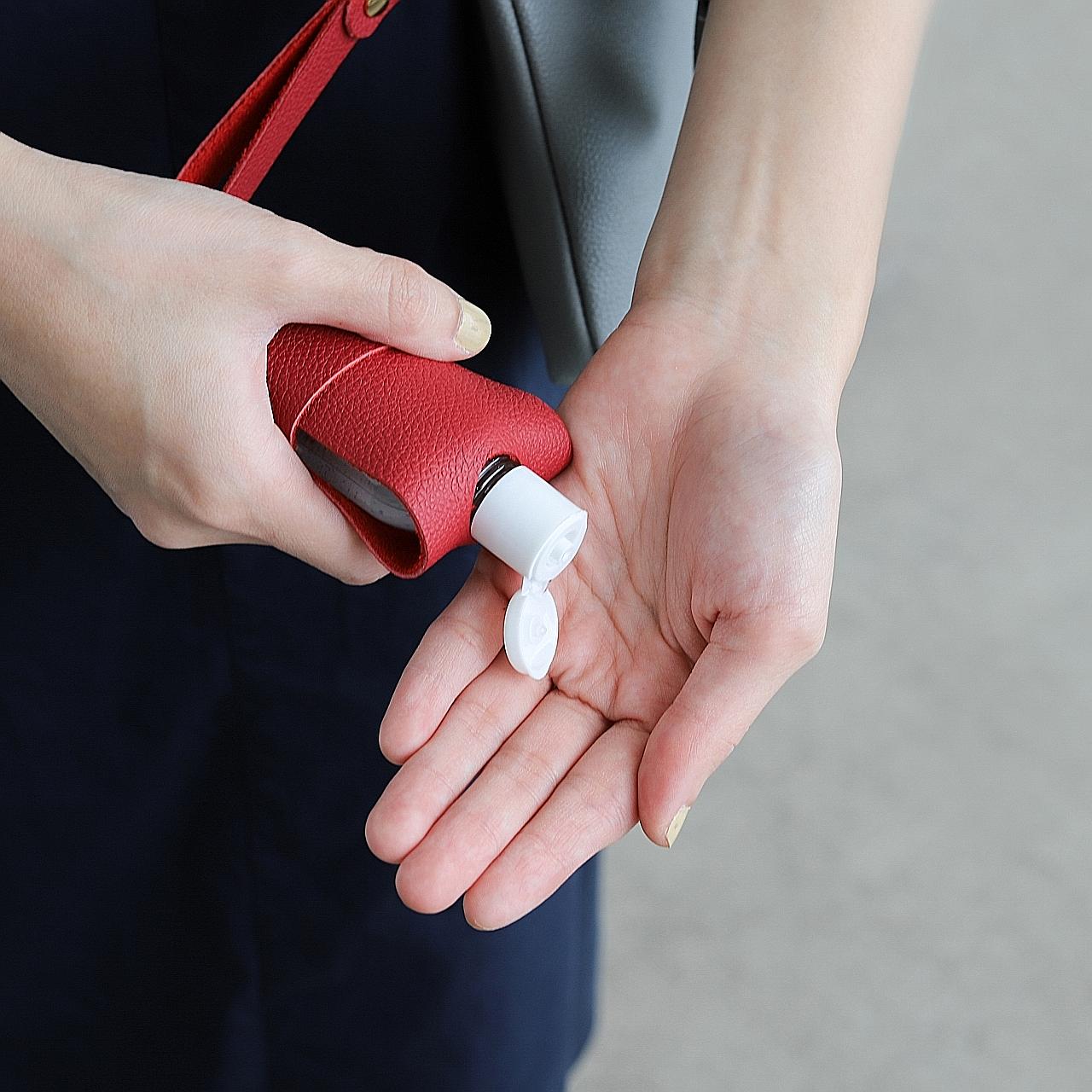 Stacks of cut masks from bespoke tailor CYC Tailor, whose main business before the coronavirus pandemic was producing men's shirts. Carry your hand sanitiser in style with a leather handcrafted sanitiser holder by Bynd Artisan. Bynd Artisan founders 