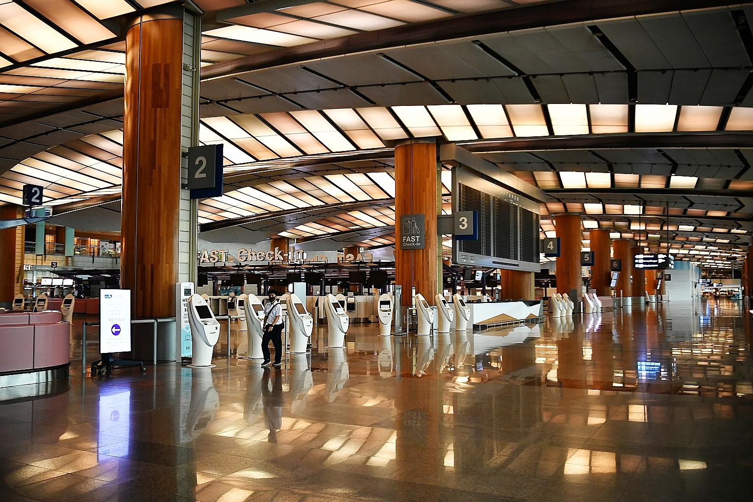 A quiet Changi Airport Terminal 2. The Government is determined that SIA will see through this crisis, says Prime Minister Lee Hsien Loong.