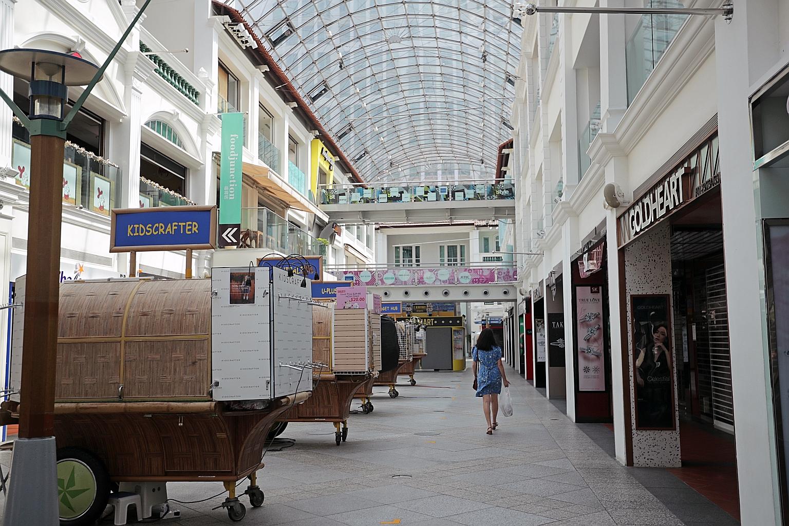 Shuttered retail outlets at Bugis Junction mall last month, after the circuit breaker measures were introduced. According to SingStat, the accommodation, food and beverage service and retail trade industries are most affected by the pandemic and, in 