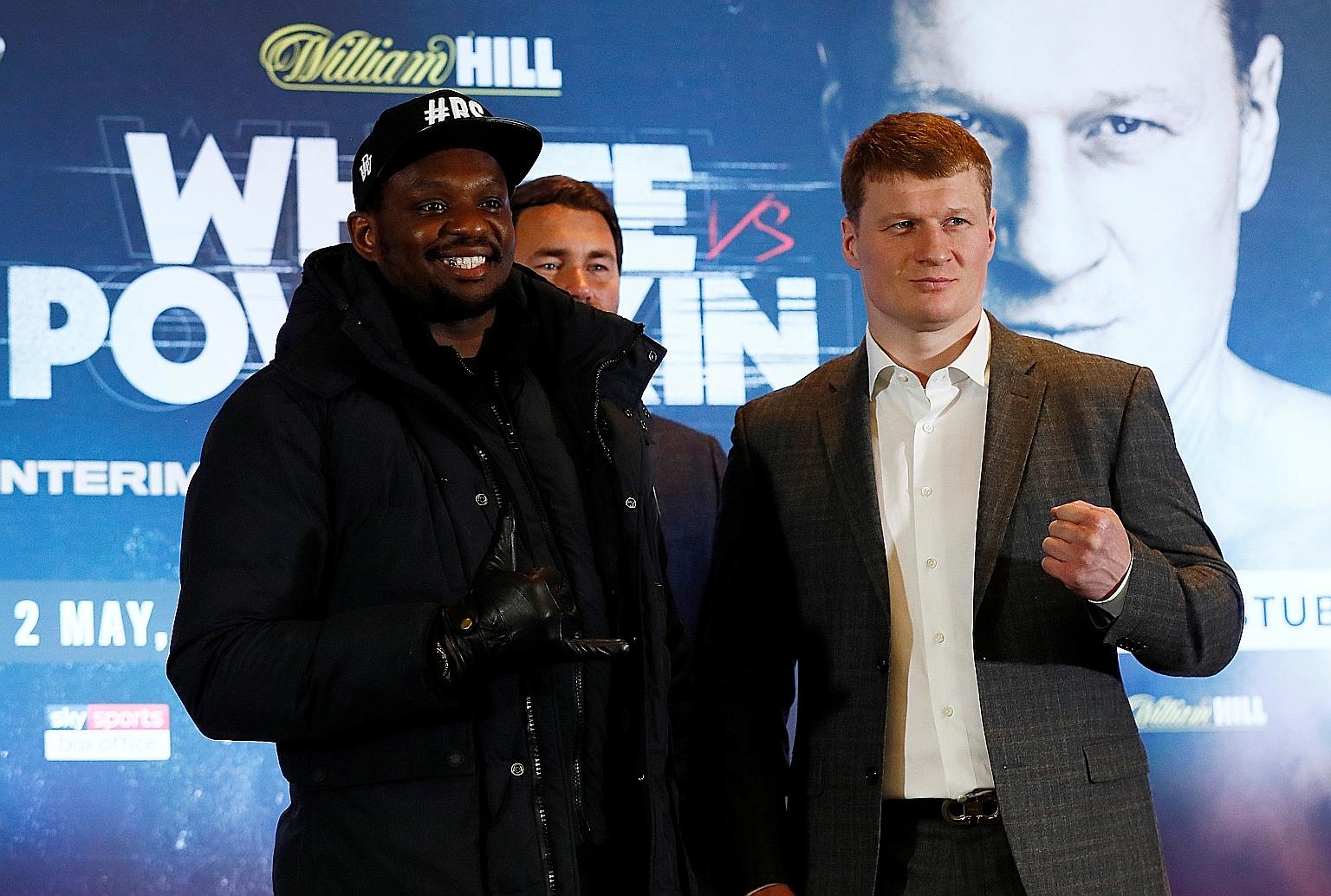 Dillian Whyte and Alexander Povetkin with promoter Eddie Hearn after their March 4 press conference in Manchester. Their postponed fight could be the first without a crowd but Hearn still wants a hotel setting.