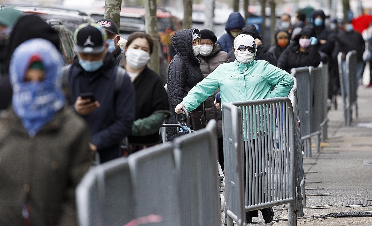 People waiting for food from a Brooklyn charity in New York on Thursday, amid rising unemployment. President Donald Trump has increasingly attacked Beijing's handling of the virus outbreak as the fallout batters the American economy in an election ye