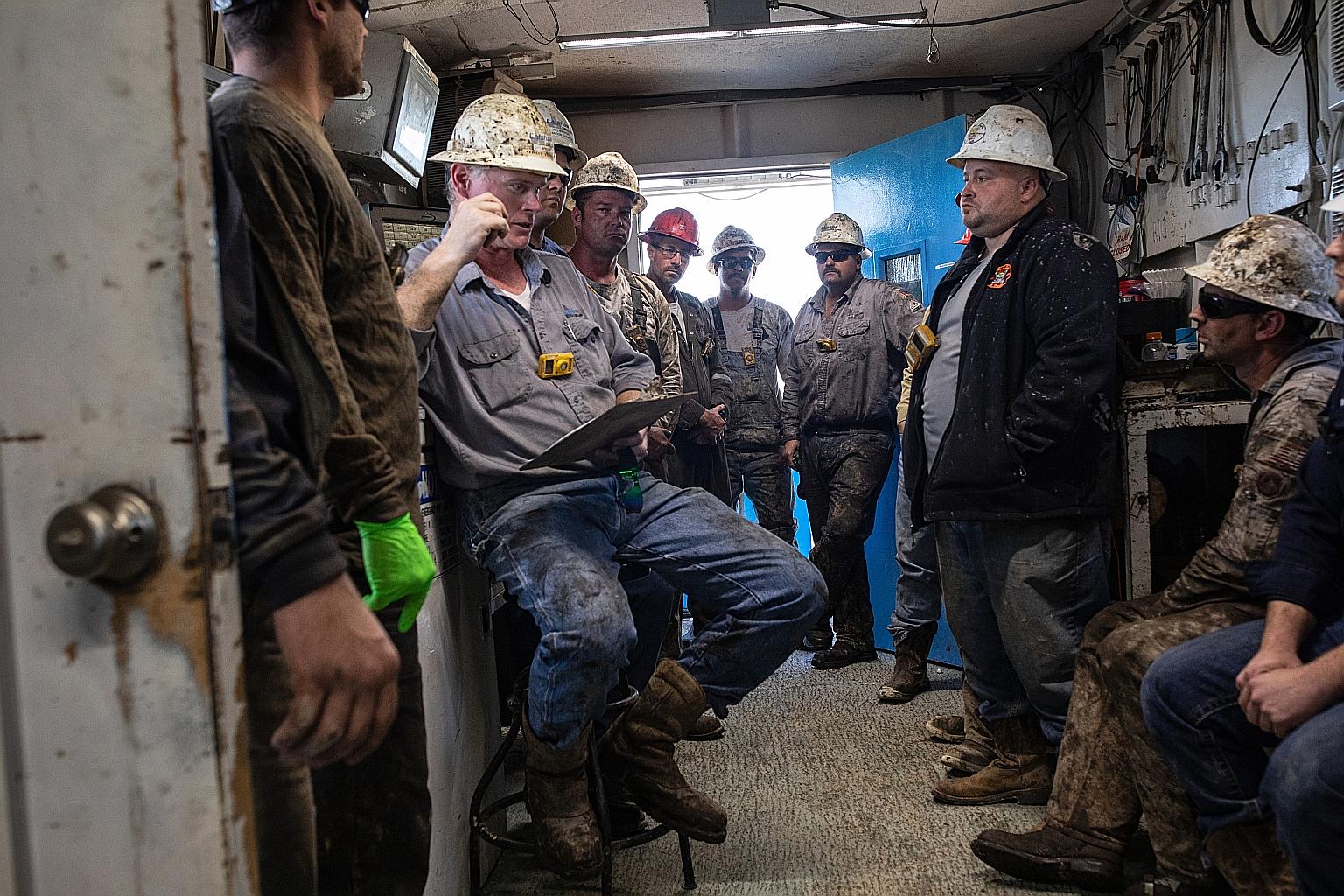 Workers at an oil rig last month in Texas, part of the US' Permian Basin, which recovered from a crash, only to face another one now. PHOTO: NYTIMES
