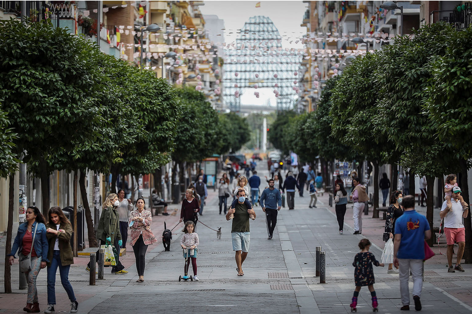 People walking down the San Jacinto street in the Spanish city of Sevilla on April 26, the first day minors were allowed an hour's walk per day since a lockdown was ordered in March. The writer says that amid the Covid-19 pandemic, ''faith is being tested