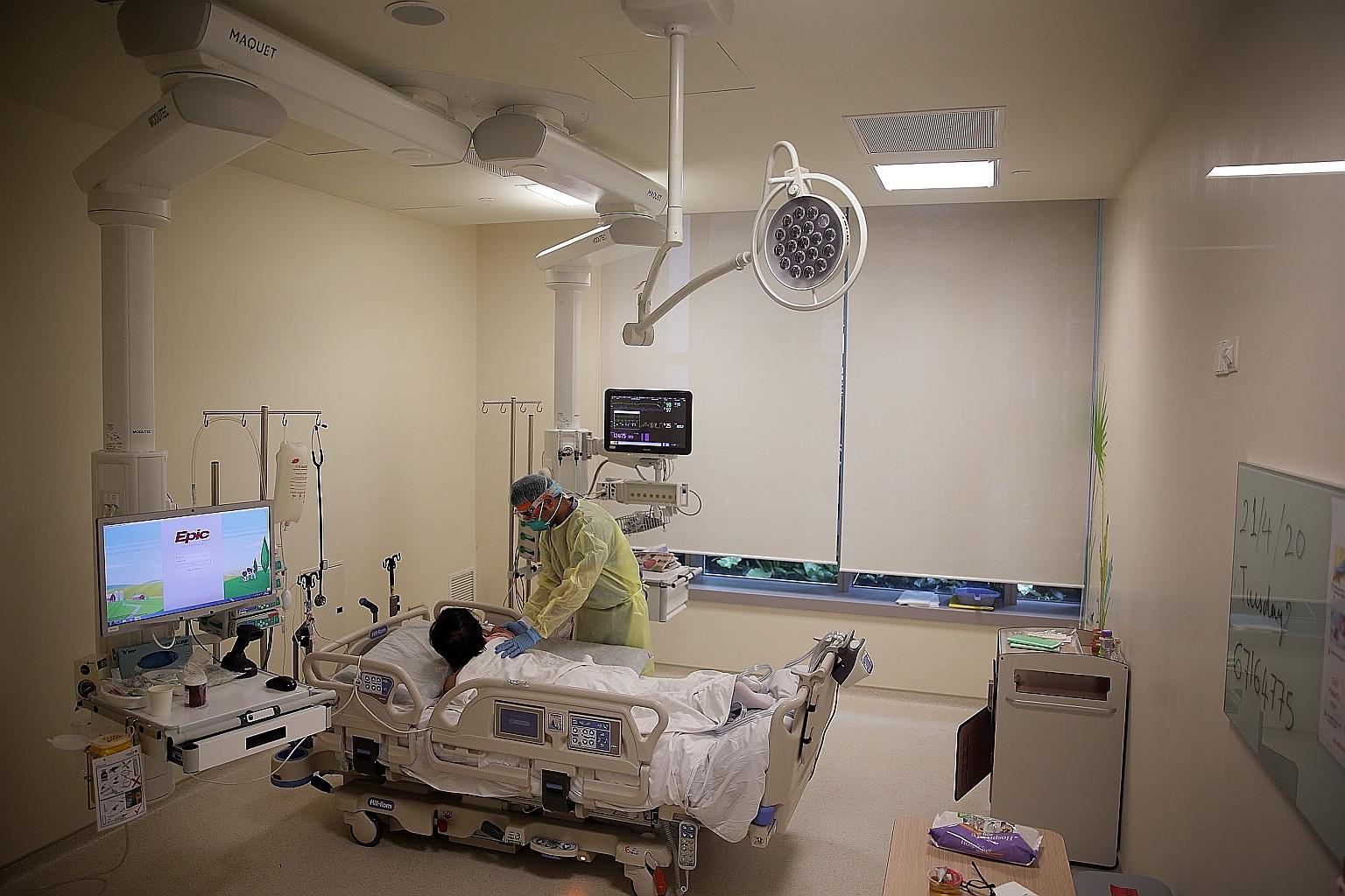 A Covid-19 patient at Ng Teng Fong General Hospital on April 21. Under measures announced on March 31, life and health insurance policyholders in Singapore can defer premium payments for up to six months.