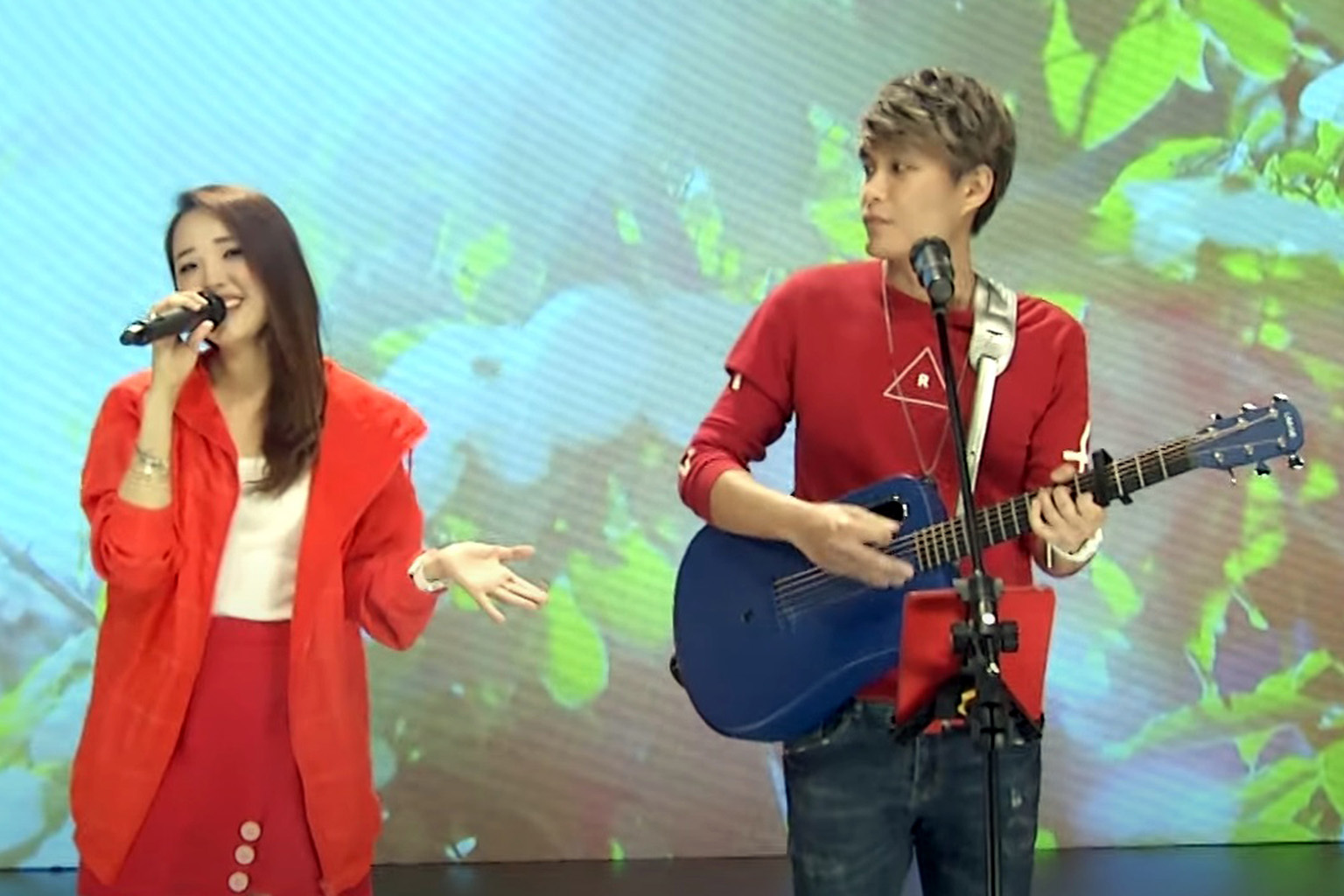 Artists Sherraine Law and Jax Lee of local duo LawLeePop performing a Mandarin song as part of the labour movement's May Day celebrations for migrant workers. PHOTO: MIGRANT WORKERS' CENTRE SINGAPORE/YOUTUBE