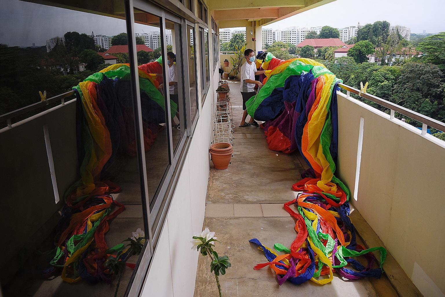 Technician Ong Ah Huat, 52, sunning his 26m-long inflatable spinner kite outside his home in Sembawang on Sunday. Mr Ong and his group of around 10 friends from kite enthusiast group Show Kites Singapore usually gather at Marina Barrage on Sunday aft