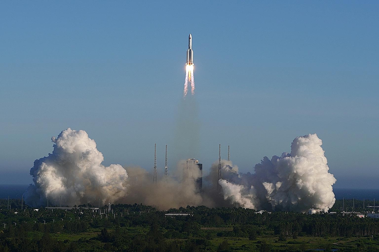 The Long March-5B carrier rocket taking off from Wenchang Space Launch Centre in China's Hainan province yesterday. PHOTO: REUTERS