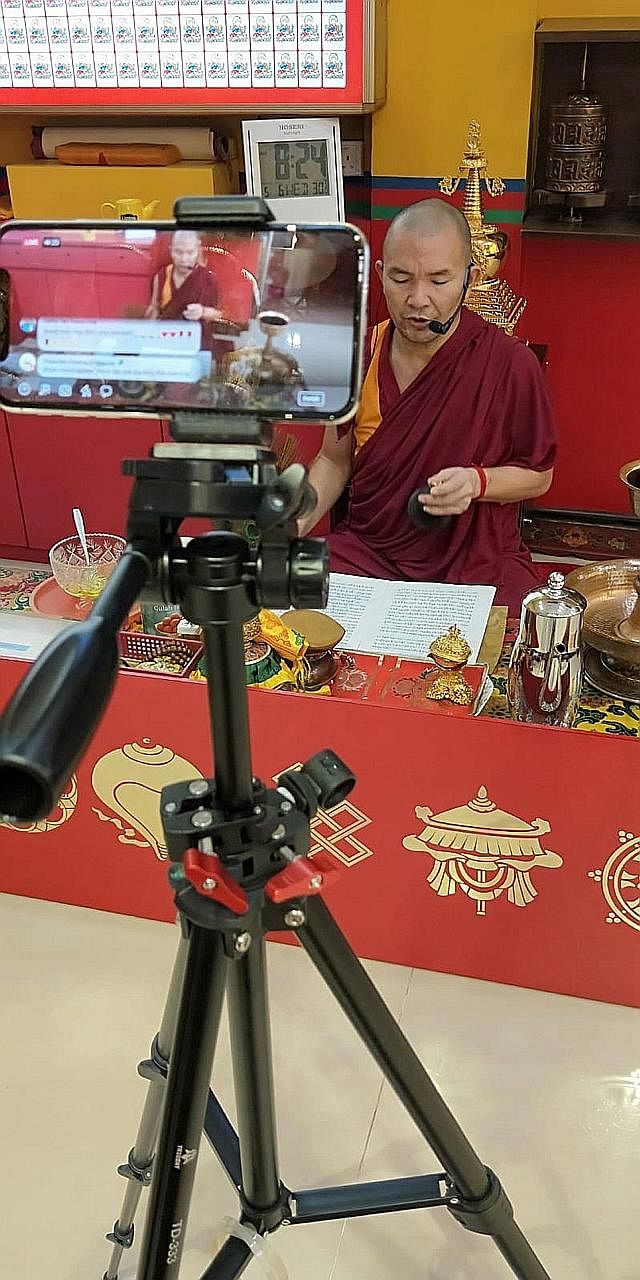 Lama Tenzin Phuntsog from Thekchen Choling (Singapore), a Tibetan Buddhist temple, during morning prayers livestreamed on Facebook. During the circuit breaker period, Buddhists have turned to online resources to practise their faith. The temple's dev