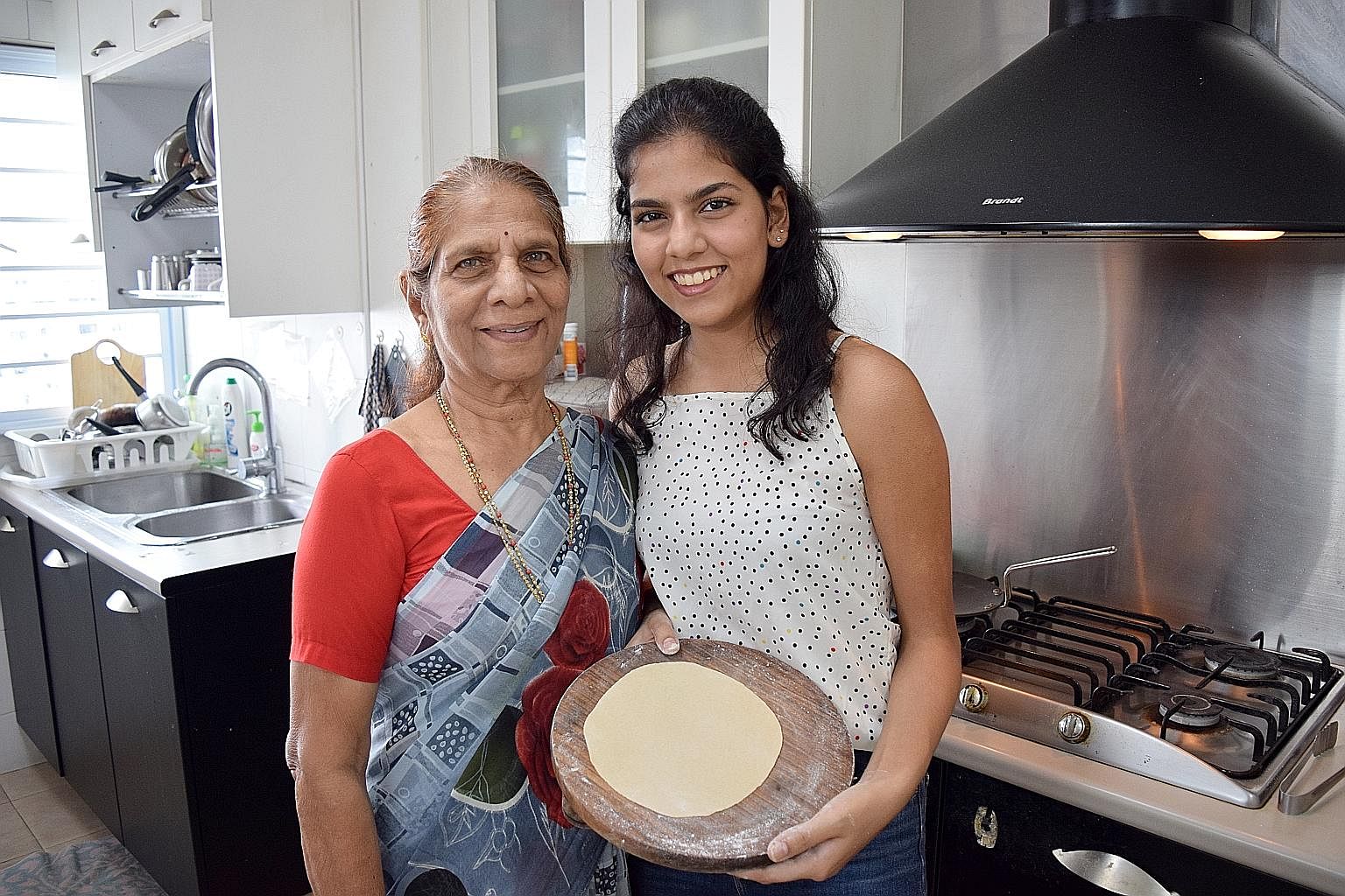 The writer, 19, is using the circuit breaker period to learn to make rotis from her grandmother, Mrs Neela Phatale (both above).