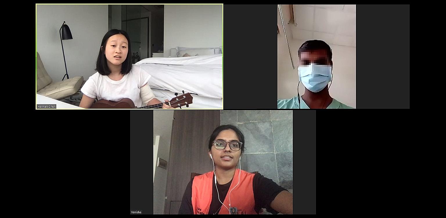 Alexandra Hospital volunteer Hannah Chen performing a medley of songs for Mr Murugam Pillai (not his real name), while another volunteer S. Venisha translates. Mr Pillai is one of 360 migrant workers with Covid-19 who have been warded in the hospital