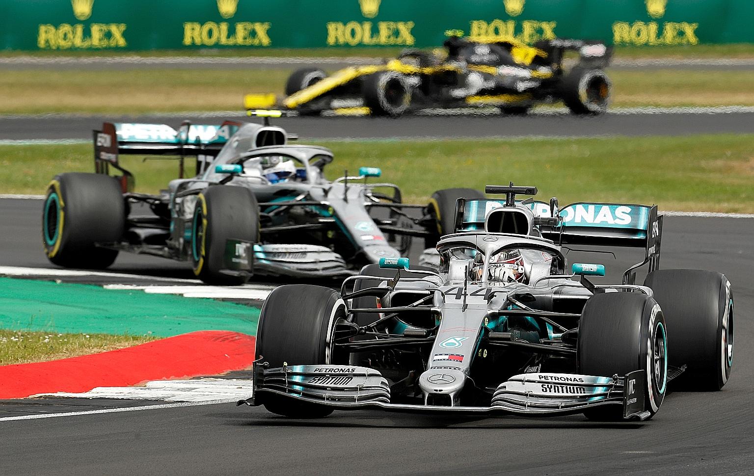 Lewis Hamilton and teammate Valtteri Bottas on their way to a Mercedes one-two at last year's British Grand Prix at Silverstone. This year's race could be held behind closed doors.