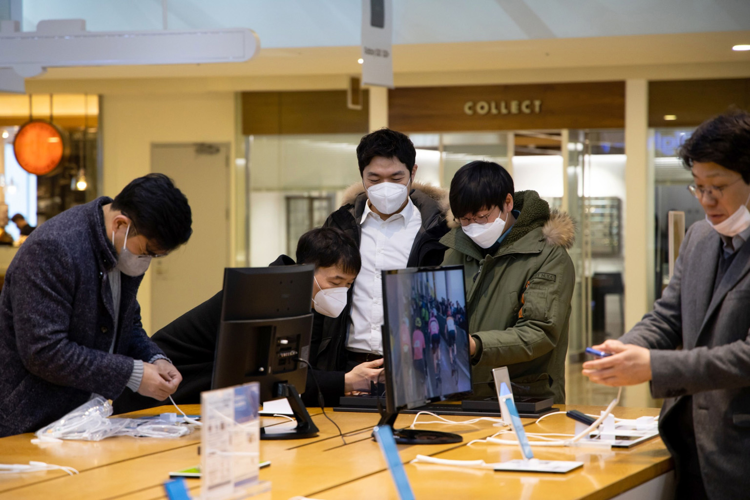 Customers trying out smartphones at Samsung's flagship store in Seoul in March. The coronavirus pandemic has hit sales of mobile devices across the board and experts warn that the rest of the year will be worse as the virus batters the global economy