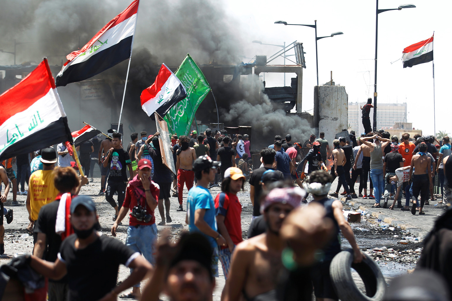 Iraqi demonstrators taking part in an anti-government protest at Al-Jumhuriyah bridge in Baghdad yesterday, days after Prime Minister Mustafa Kadhemi's government came to power. The rallies first erupted in the Iraqi capital and Shi'ite-majority sout