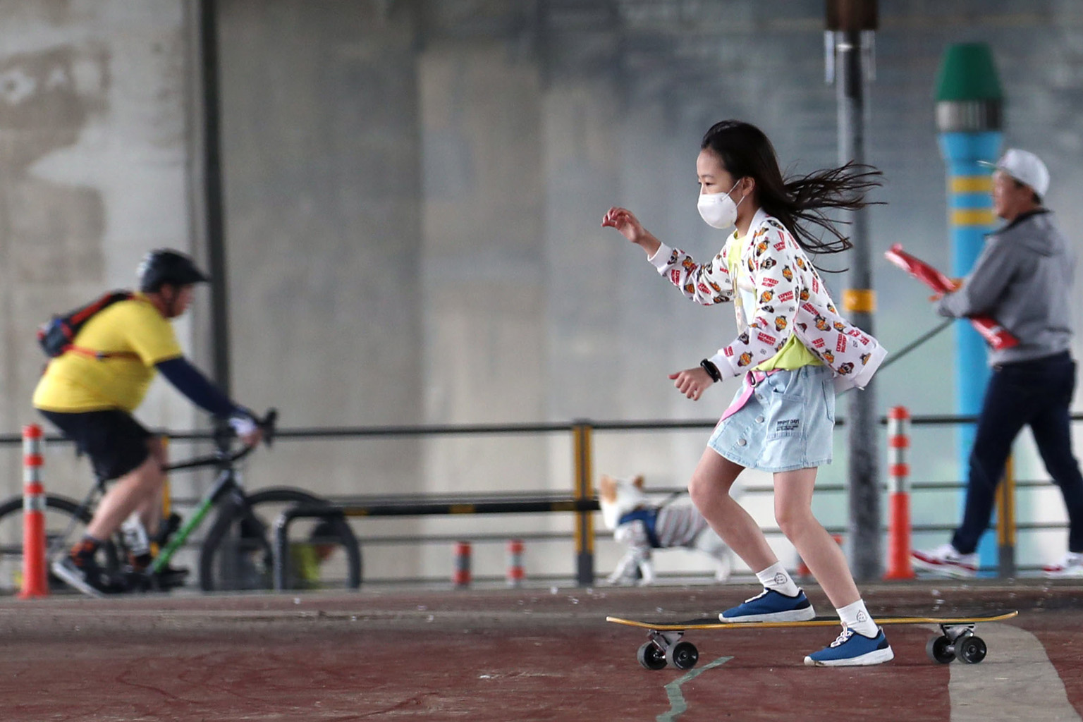 A child riding a skateboard at Yeouido Hangang Park in Seoul yesterday, the first Sunday since the South Korean government eased its social distancing measures. Yesterday, the country reported 34 new infections, the highest since April 9, after a sma