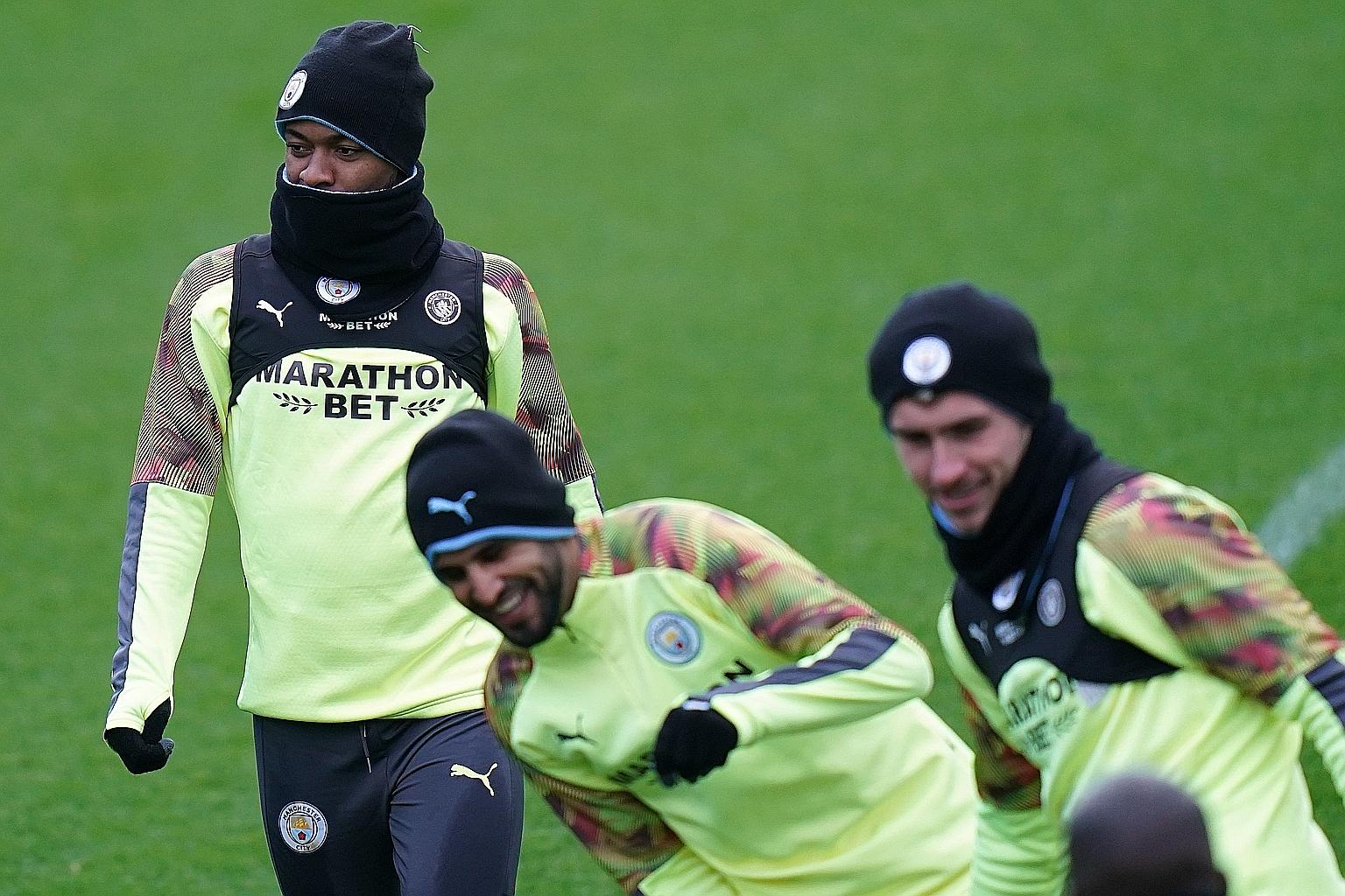 From left: City's Raheem Sterling, Riyad Mahrez and Aymeric Laporte during training in February. Sterling is among players concerned about the risk to themselves and their families if they returned to the pitch before the virus subsides. PHOTO: AGENC