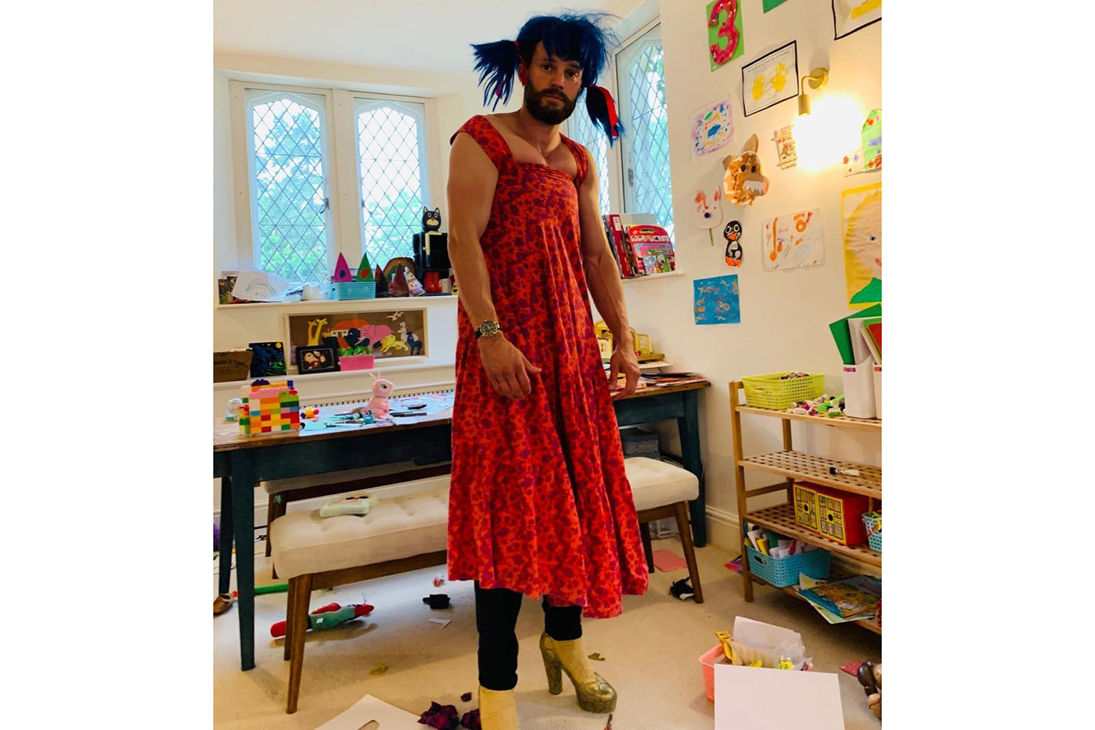 DADDY PLAYS DRESS-UP: Fifty Shades Of Grey actor Jamie Dornan posted on Instagram on Sunday a picture of himself wearing a red dress over his jeans and high heels, after his daughters gave him a makeover. The Irish actor, 38, who has been under lockd