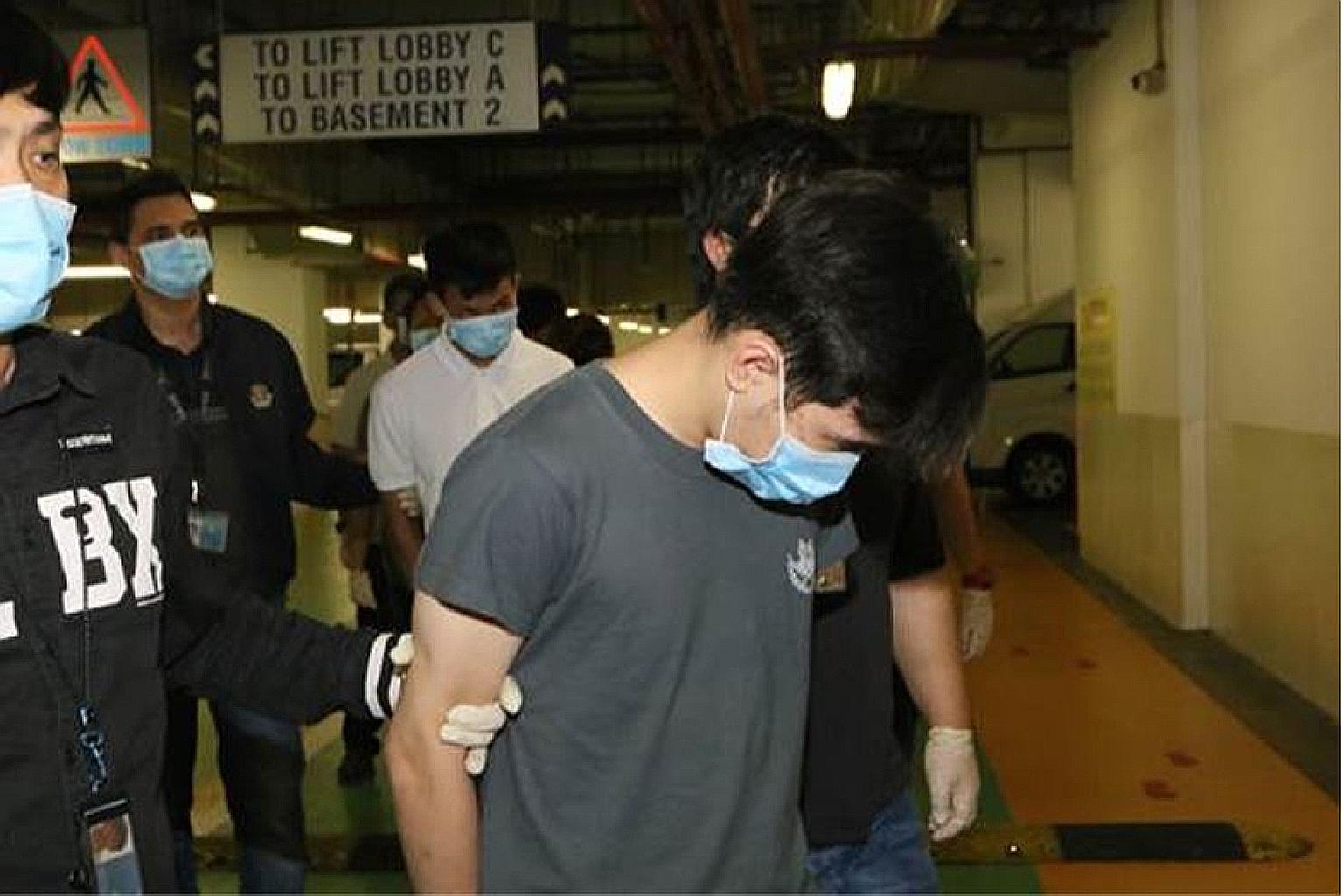 The police with eight men and one woman who were arrested on Tuesday following a manhunt. Two groups of people were captured on CCTV fighting at a Chinatown apartment block on Sunday.