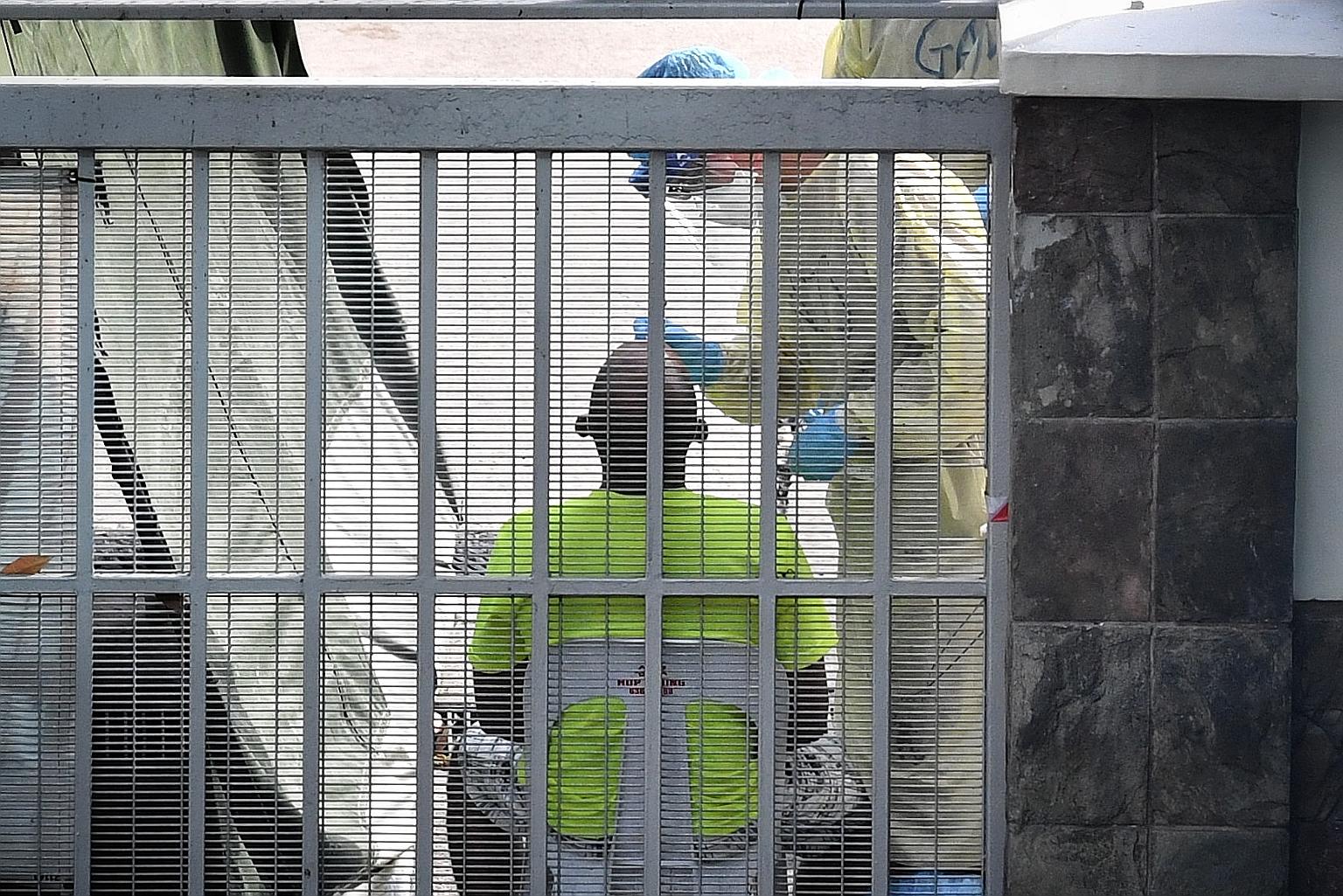 A dormitory resident getting a swab test during a medical examination in Toh Guan Dormitory on May 2. The Health Sciences Authority says it has been working with research institutions and companies since the end of January to ensure "the timely avail