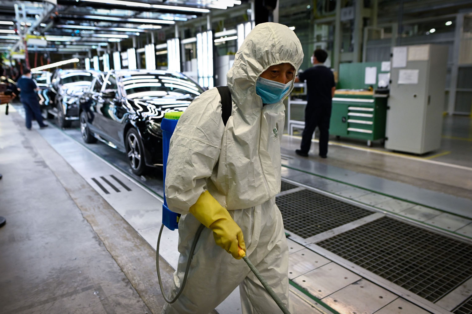 A cleaner spraying disinfectant at a plant in Beijing on May 13. Millions of Chinese people are being thrown out of work by the collapse in global demand and a slow restart of the domestic economy. A lack of clarity about exactly how many is making i