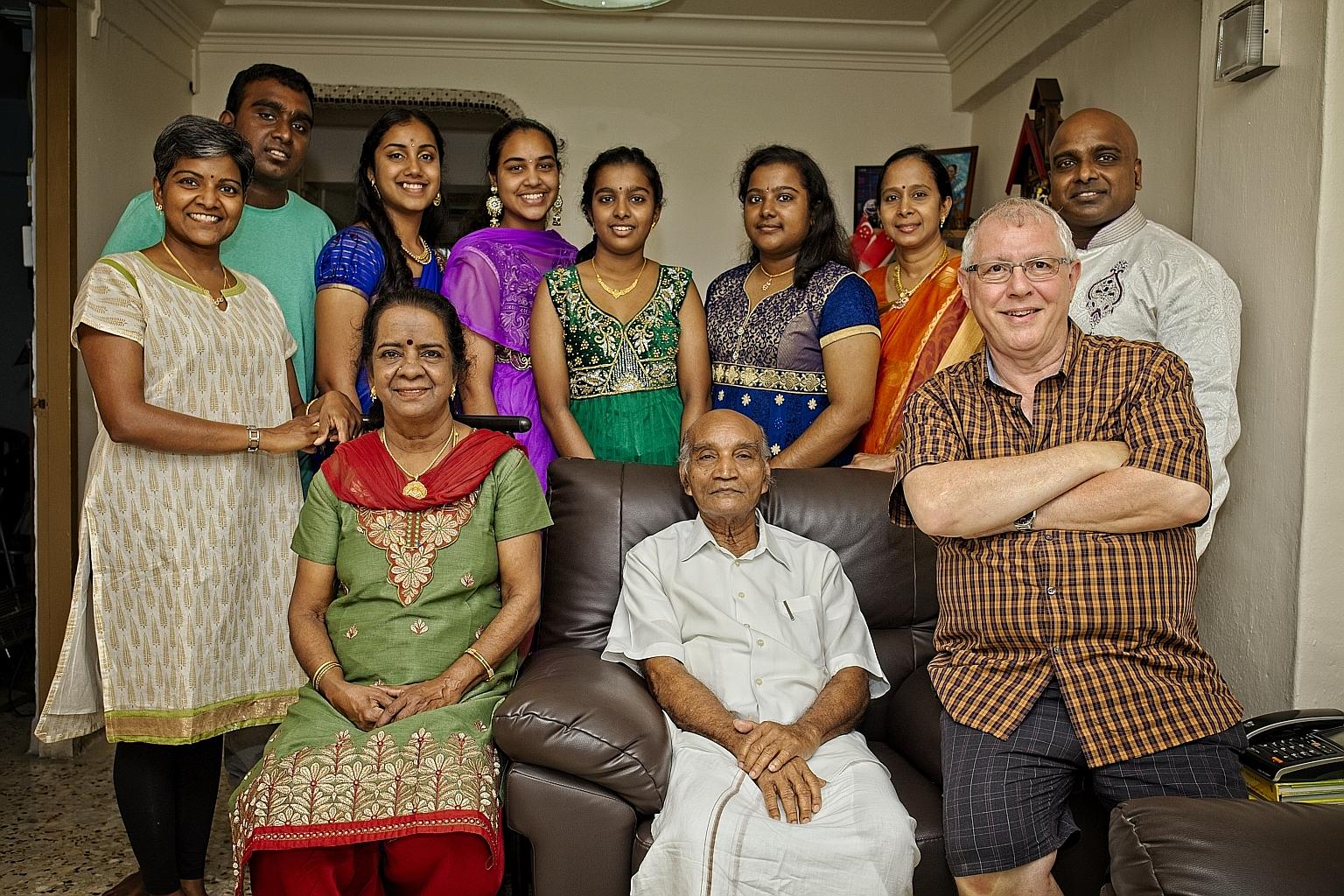 Mr K. Ramaswami, flanked by wife Solosana and son-in-law Paul Lambourne, with (standing, from left) daughter Kohilavani, grandson Piravin, granddaughter-in-law Saranya and her sister Vanitha, granddaughters Piriytha and Piriyatharisini, daughter-in-l