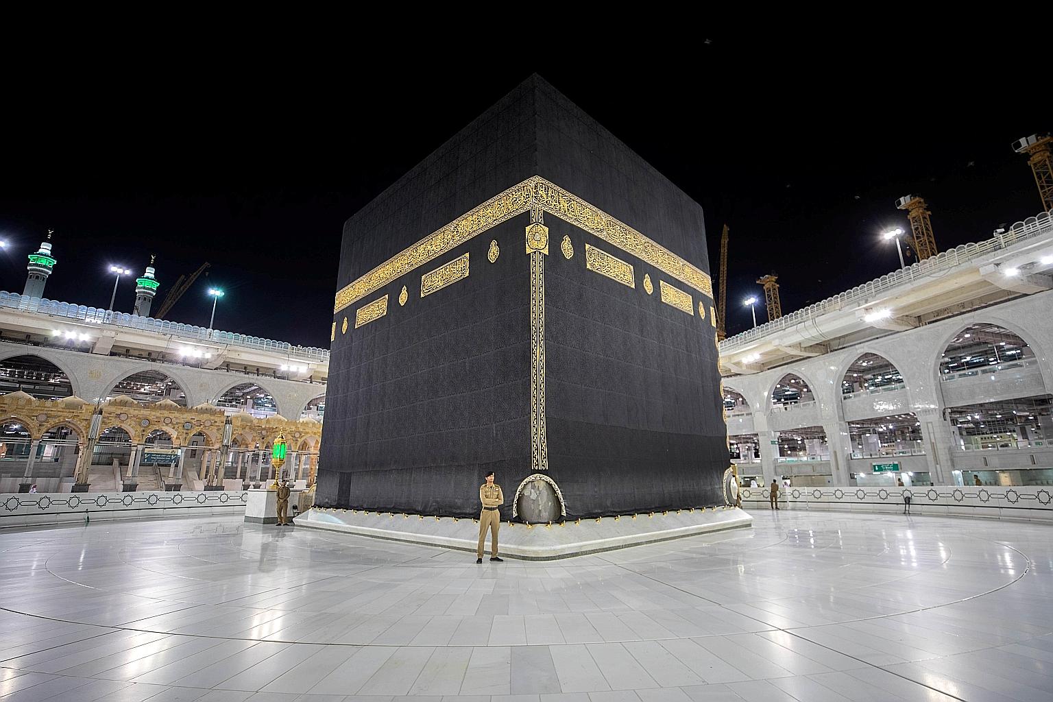 Saudi security officers on guard around the Kaaba inside the empty Great Mosque of Mecca earlier this month. It is still unclear whether the Saudi authorities will allow the haj to take place this year. Saudi Arabia has yet to make an official announ
