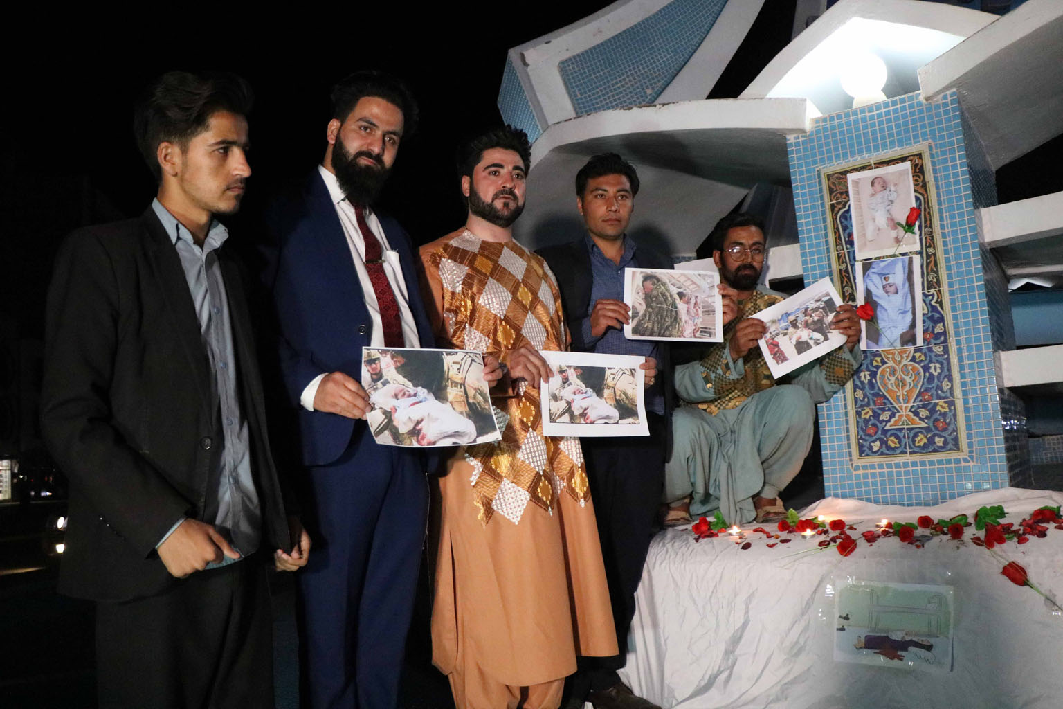 Afghans at a memorial service on Wednesday for the victims of two attacks - one on a hospital and the other at a funeral. The Afghan government on Wednesday blamed the Taleban for the attacks and ordered the military to switch to "offensive mode".