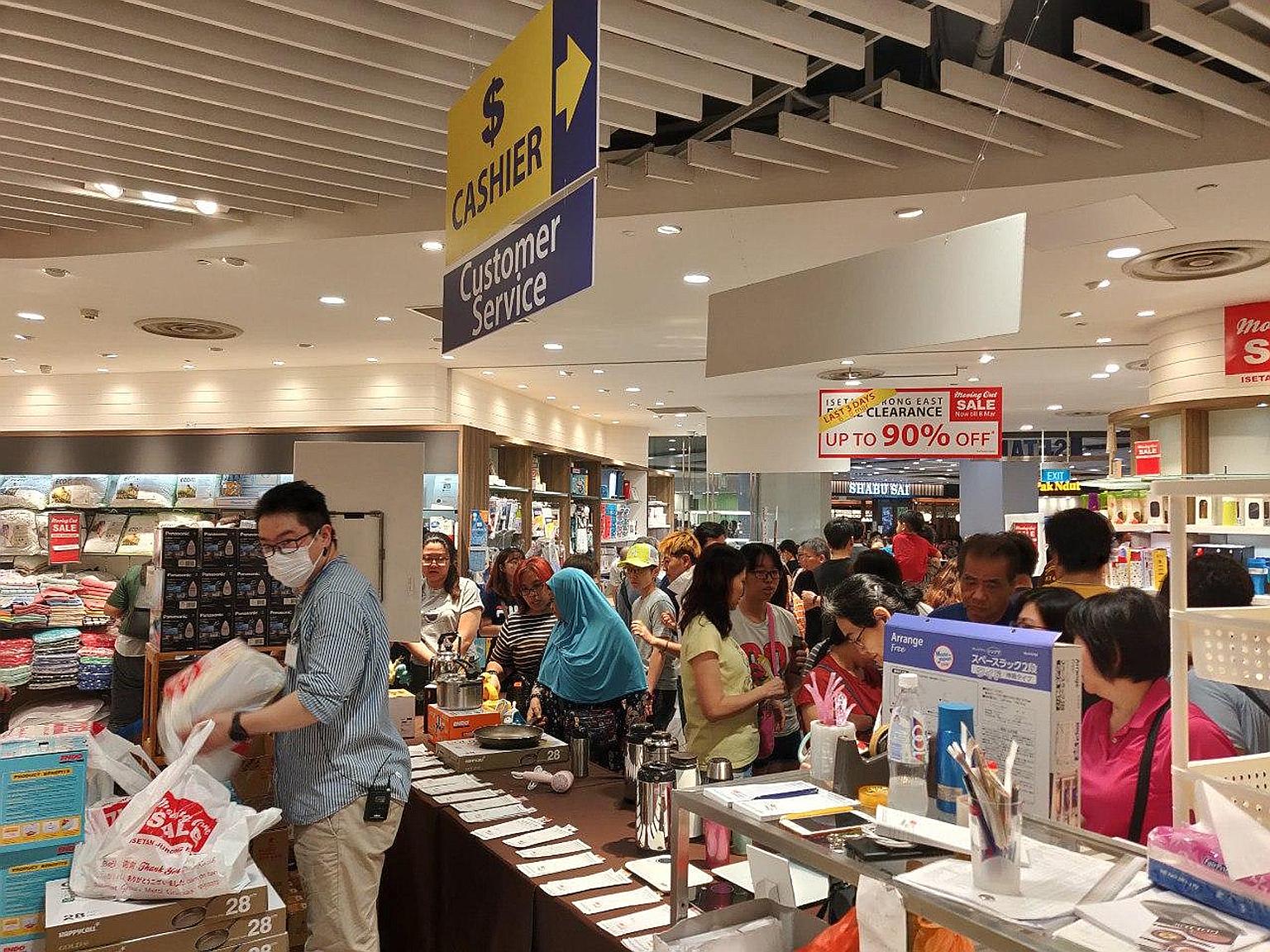 Shoppers at Isetan's moving-out sale in suburban mall Westgate on March 7. The retailer says it expects a loss for the first half of this year, because of the disruptions to business from the coronavirus outbreak, the limited extent to which expenses