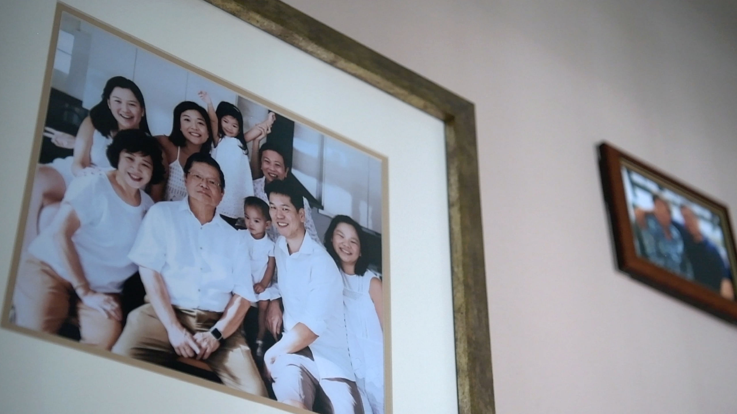 A family photo on the wall at Steven’s home. The family decided to take photographs together when Steven was diagnosed.