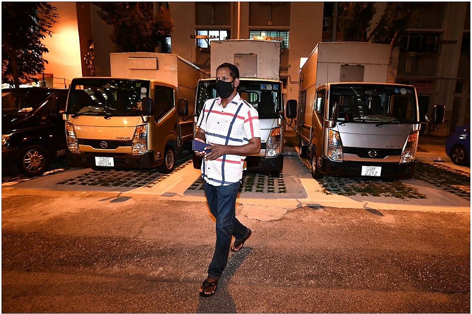 Mr Xavier Mathew, 45, who works for a florist, on the way to shop for groceries after midnight, as soon as his stay-home notice ended. He is among 85,000 foreign workers staying in flats, hotels and condominiums following measures to contain the spre