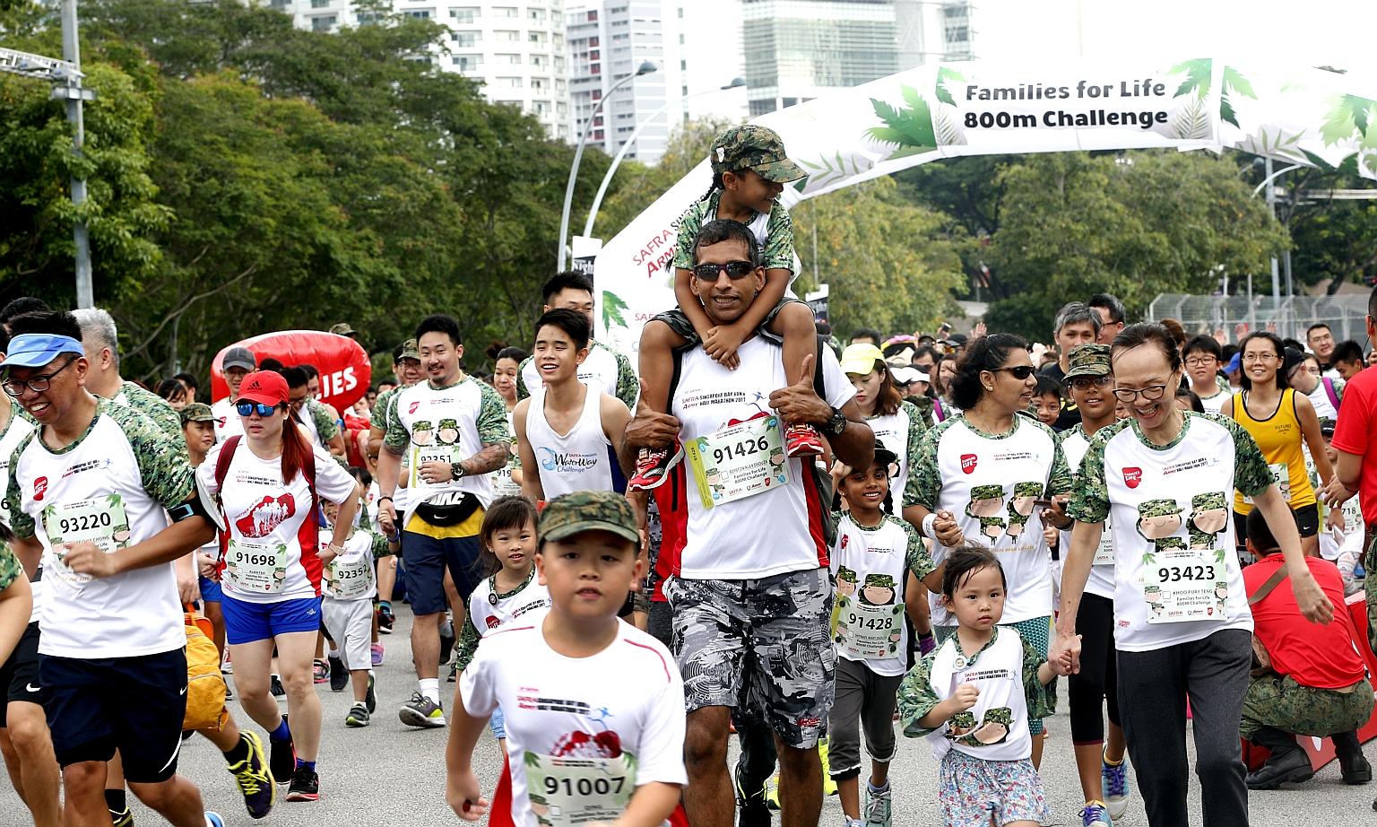 Parents running with children in the 800m race at the 2017 Safra Singapore Bay Run and Army Half Marathon. This year's event will not be held owing to the coronavirus pandemic. ST FILE PHOTO