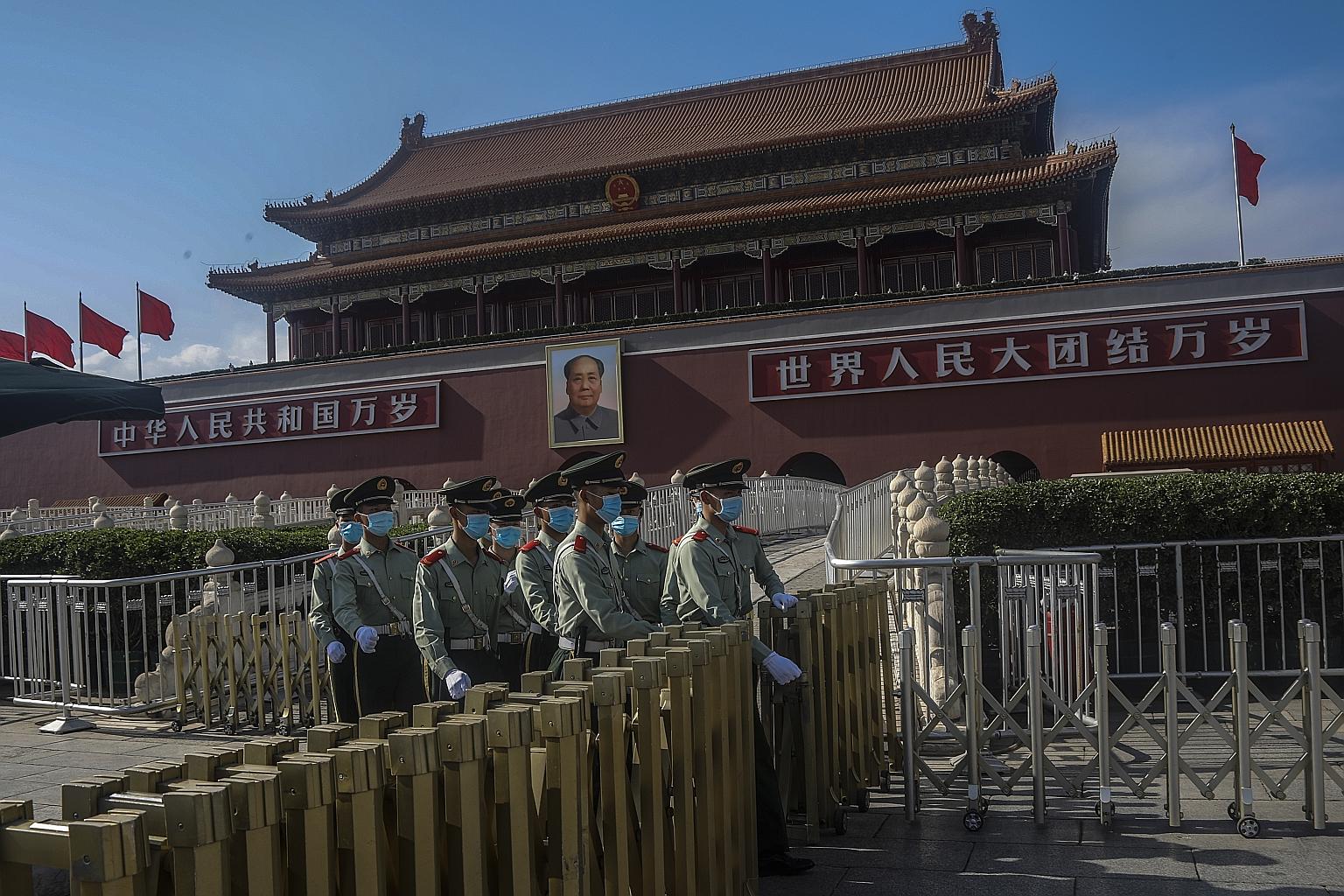 Chinese paramilitary police officers in Beijing's Tiananmen Square as China gears up for its annual political meetings. PHOTO: EPA-EFE