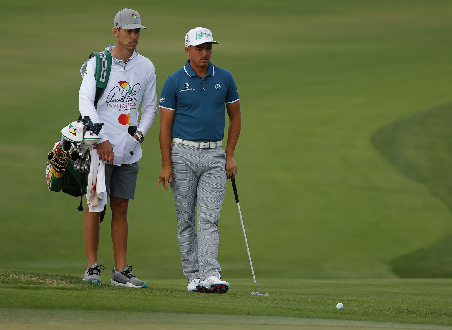 Rickie Fowler, ably accompanied by his caddy Joe Skovron, at the 11th hole of the Arnold Palmer Invitational in March.