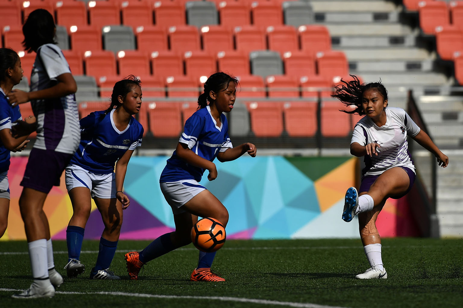 Footballer Putri Nur Syaliza (in white), is relying on the Singapore Olympic Foundation-Peter Lim scholarship for new gear.
