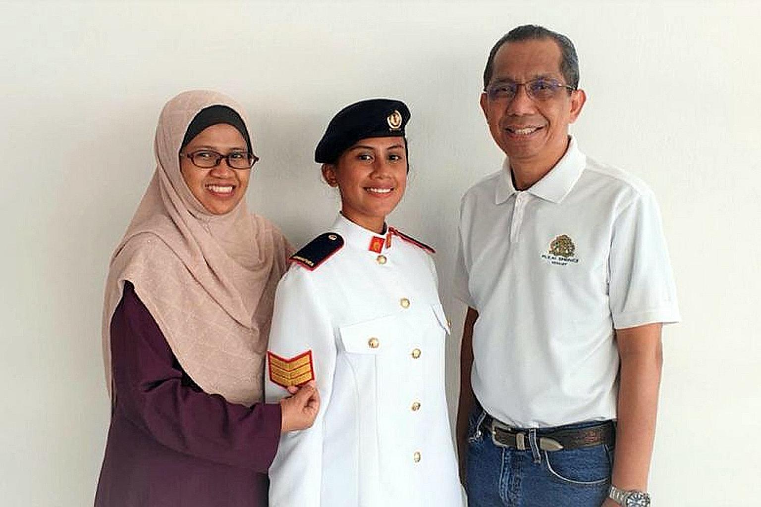 Third Sergeant Maisarah Abdul Raof with her new rank on her ceremonial uniform, in a photo taken at home with her parents. She was allowed to bring her ceremonial uniform home so her parents could affix her new rank for her, a ritual traditionally do