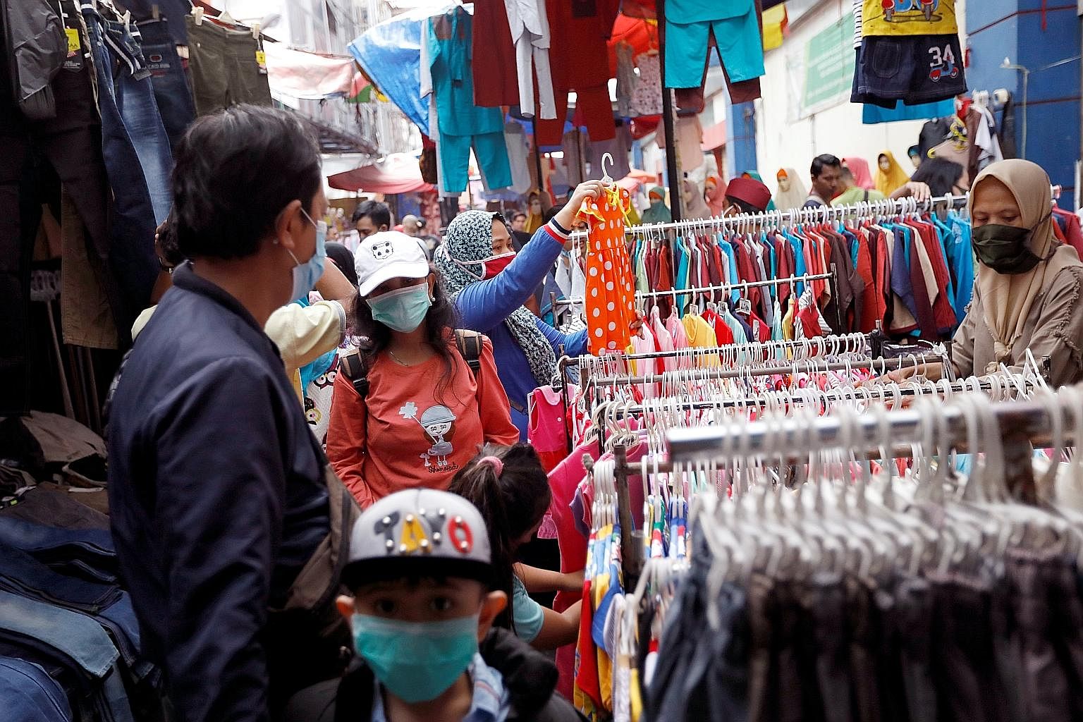Tanah Abang market (above) in central Jakarta is among many that have been teeming with shoppers ahead of Hari Raya Aidilfitri on Sunday.
