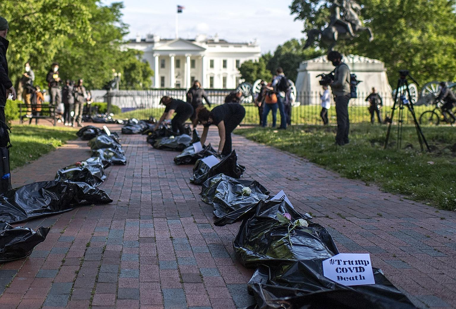 Demonstrators displaying fake body bags during a protest in front of the White House in Washington on Wednesday. The Bill passed by the US Senate applies to all foreign companies, but targets China's unwillingness to allow American regulators to rout