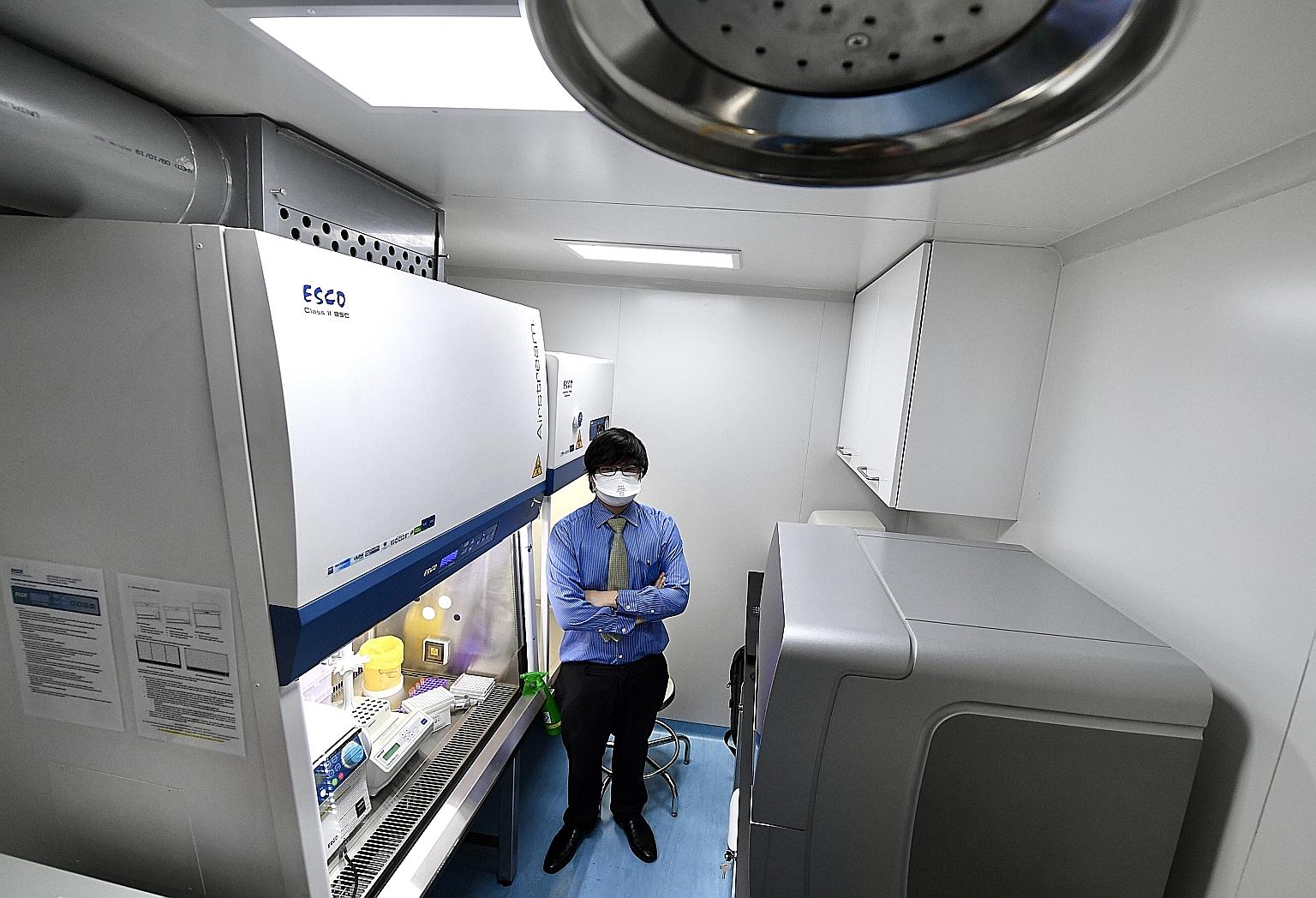 Esco Aster chief executive Lin Xiangliang inside a mobile testing lab that will allow diagnostic tests to be conducted in a smaller offsite location, for example, in a container that is 3m long, instead of in a laboratory.