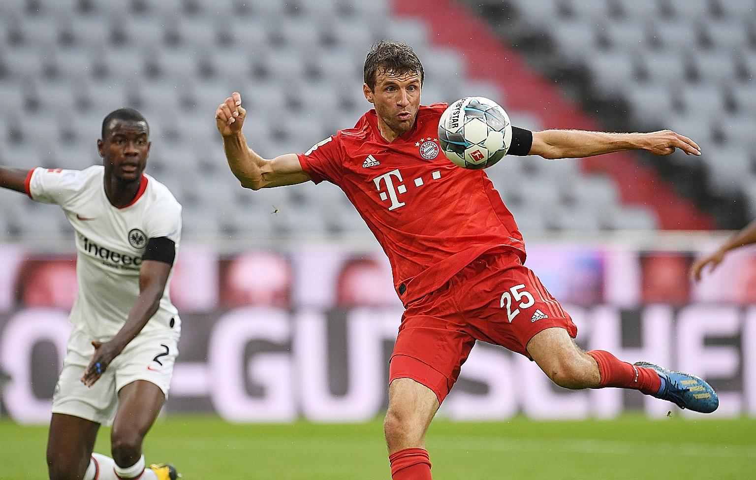 Bayern's Thomas Muller controlling the ball during the 5-2 win over Frankfurt on Saturday that restored their four-point lead.