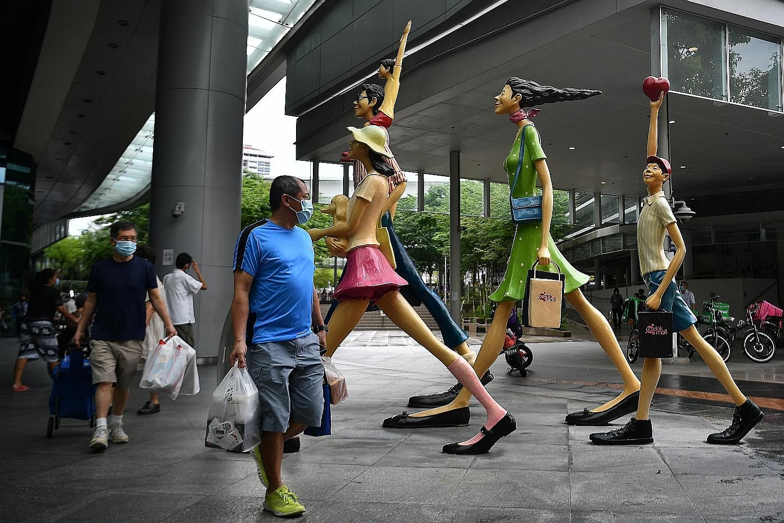 Shoppers outside Bedok Mall last week. With shops and food and beverage (F&B) dine-in set to reopen soon, retail real estate investment trusts such as CapitaLand Mall Trust, Frasers Centrepoint Trust, Lendlease and F&B stocks Koufu and Jumbo will ben