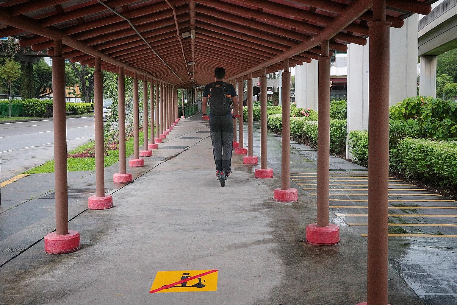 A sign in Boon Lay Way indicating that personal mobility devices (PMDs) cannot be ridden on footpaths. Open spaces such as courtyards and plazas will be designated as public paths later this year. Bicycles are allowed on public paths, but motorised P